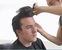 Man whose hair is being combed