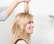 Woman whose hair is being held up